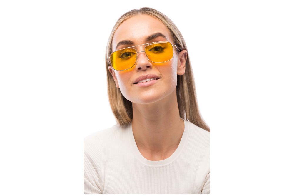 Woman Wearing Magnum Light Sensitivity Glasses Prescription