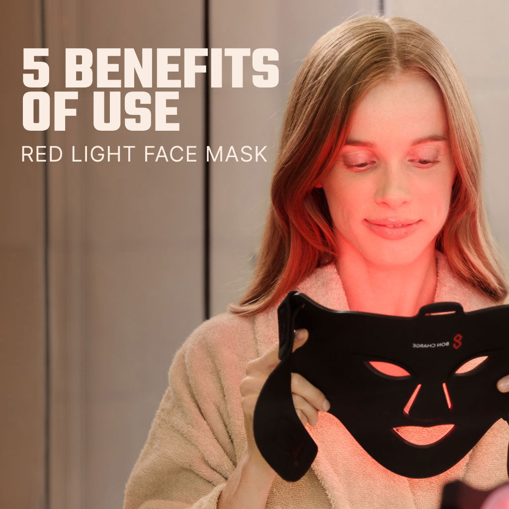 Woman In Bathroom Holding Red Light Face Mask